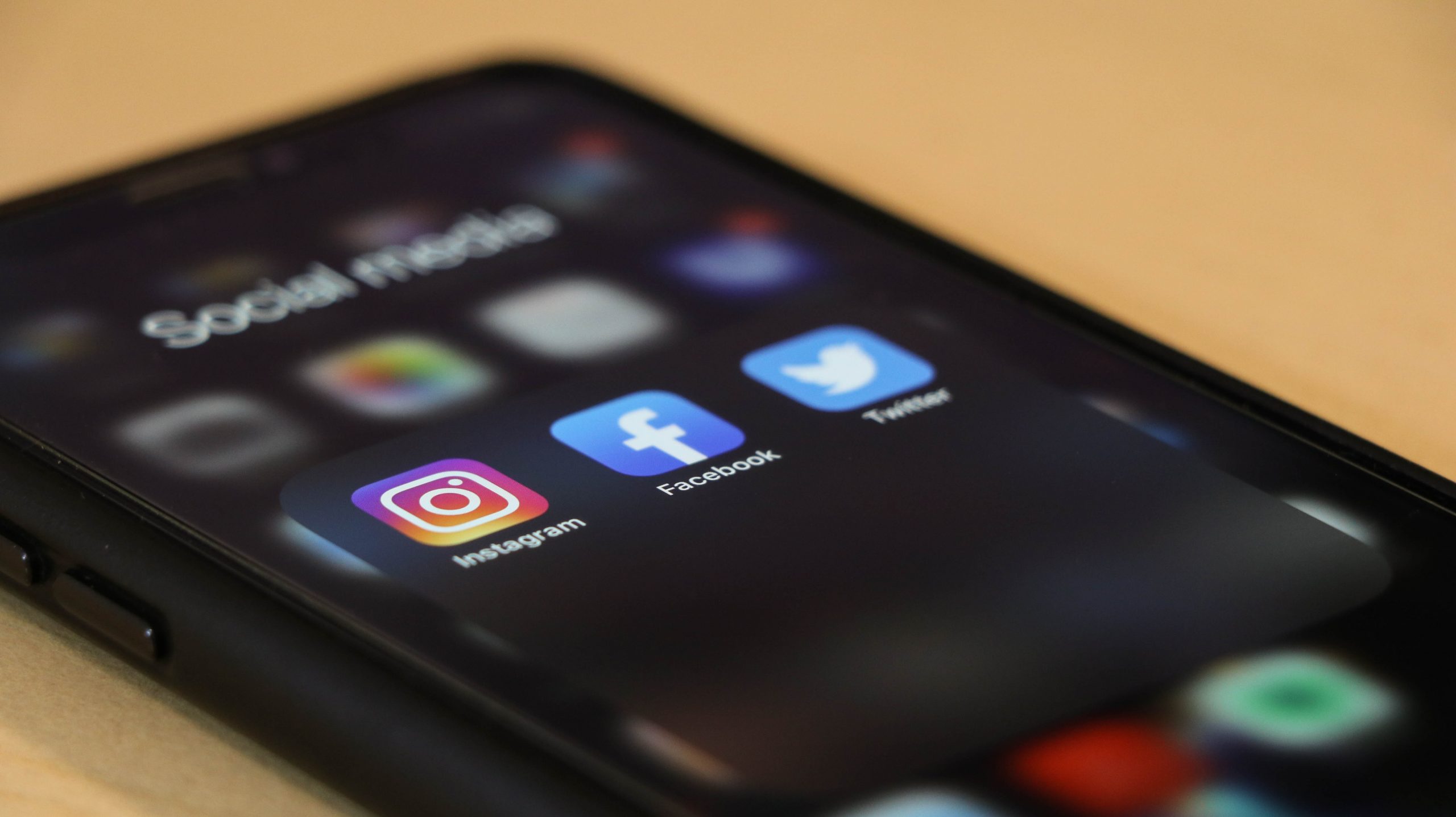Instagram, Facebook and Twitter logo on a phone screen.