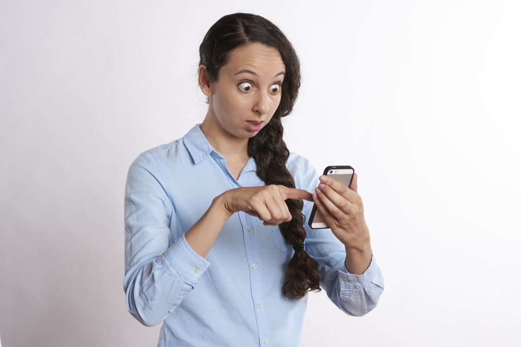 Women looking shock while on the phone 